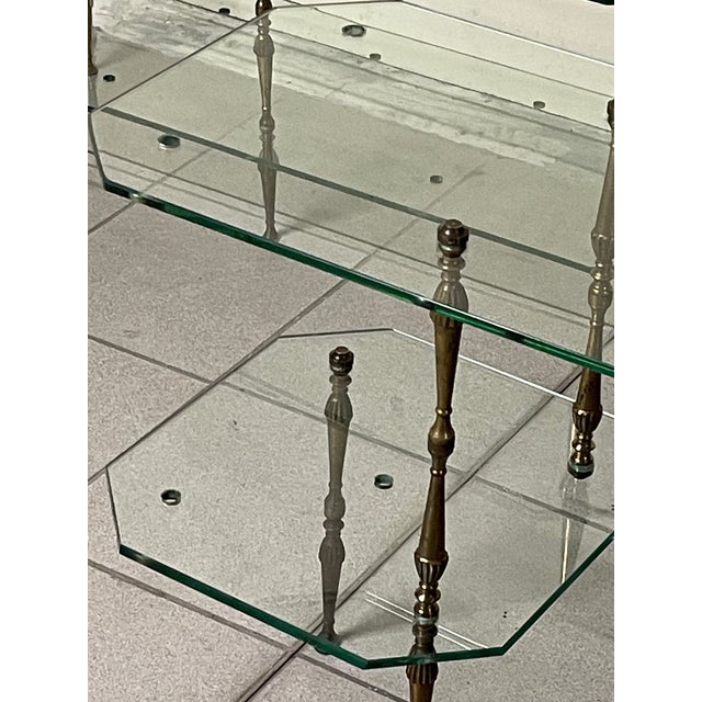 A set of modular glass and brass etagères, Italian design, dating back to the 1950s. They feature a lightweight and...