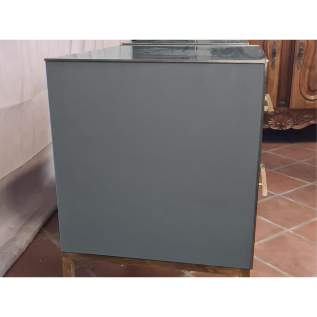 An exquisite pair of vintage Italian bedside tables, a testament to the elegance of Mid-Century Modern. Handcrafted in...