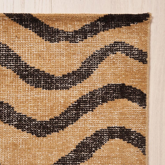 A wildly chic hand-knotted design made of wool and cotton, Zebre features a large-scale abstract animal pattern. Inspired...