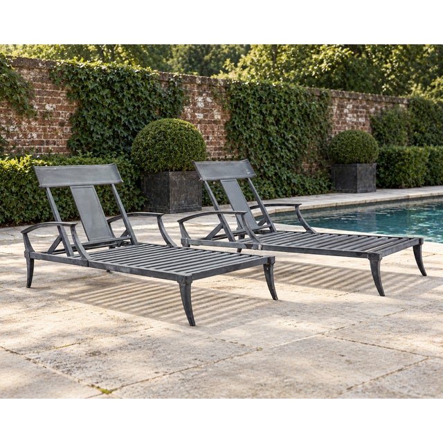 Amazing pair of Klismos chaise lounges crafted from cast aluminum attributed to Restoration Hardware now RH. The chairs...
