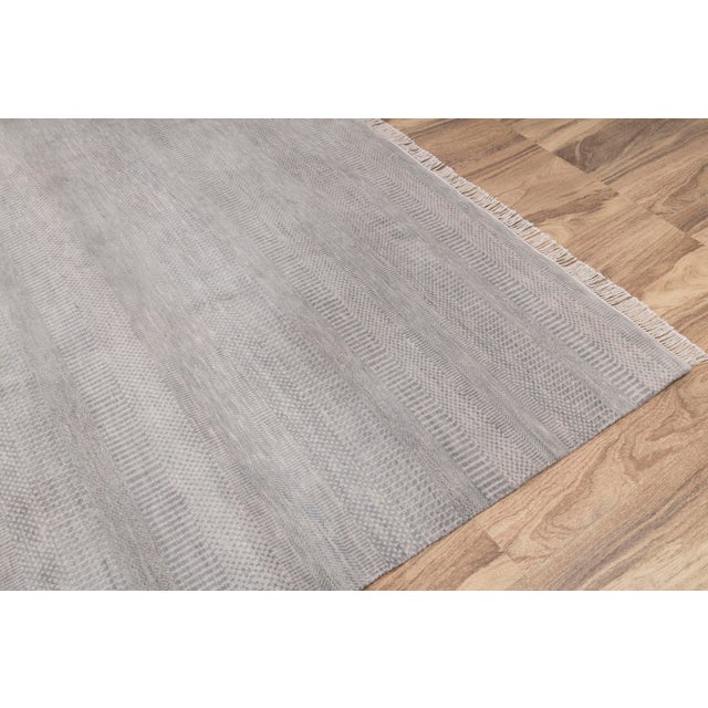 Featuring a super soft wool surface, the rug is easy to wash and maintain. Every inch of this rug is made by hand.