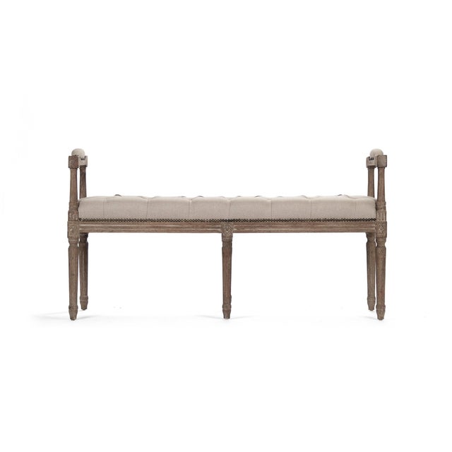 The Nicolas Tufted Bench has unique handles that are also cushioned. The bench is intricately carved from limed grey oak...