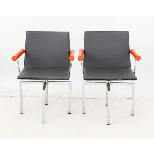 Pair of Il Loft "HI.02" Hils Leather Swivel Arm Chairs, with grey leather seat and back and orange leather arms, with "Il...