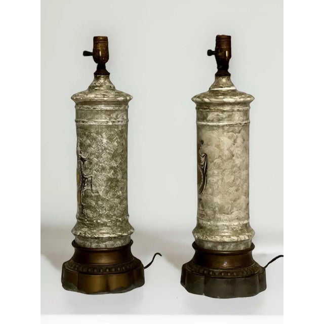 Pair of French Neoclassical style églomisé columnar lamps, c. 1910-1920. Gorgeous pair of table lamps in églomisé with two...