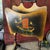 This 1920's wooden magazine rack features two charming hand-painted Dutch scenes, dual compartments for storage, and...
