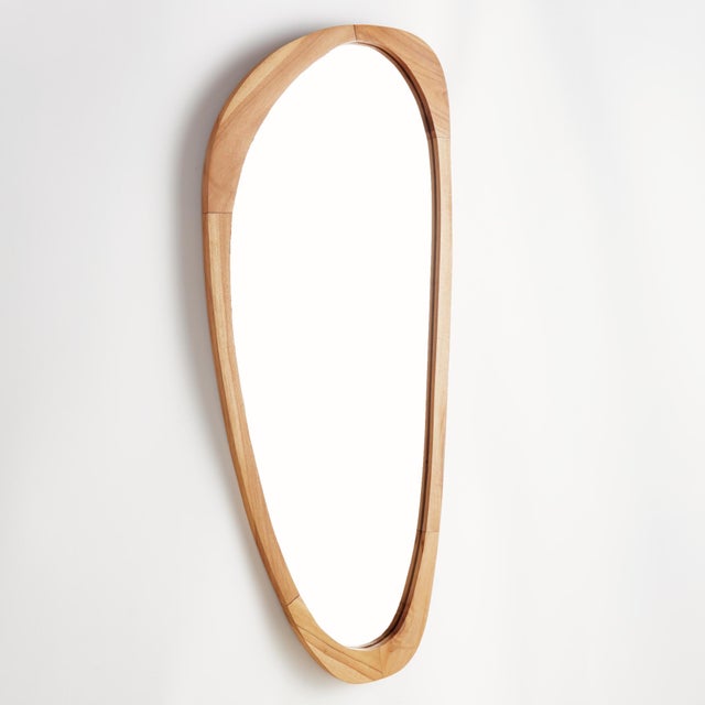 This well scaled mirror is framed with a teak wood. A beautiful grain with a smooth, honed finish. With it, s unique...