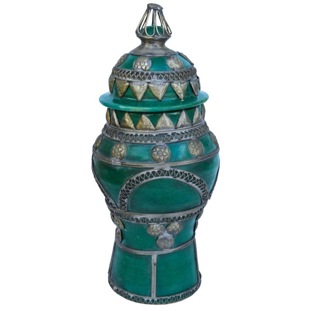 Handcrafted and glazed ceramic vase with a lid and intricate filigree design in silver nickel from Fez, Morocco. No...