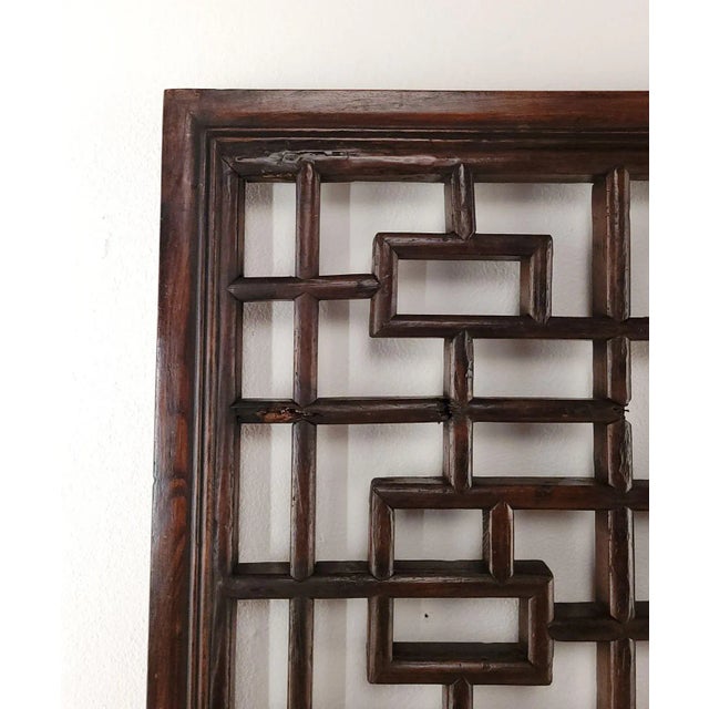 A Chinese window panel, circa 1900. One loss.