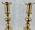 A pair of English Georgian brass beehive and diamond candlesticks with their push-up mechanisms intact. The push-up...
