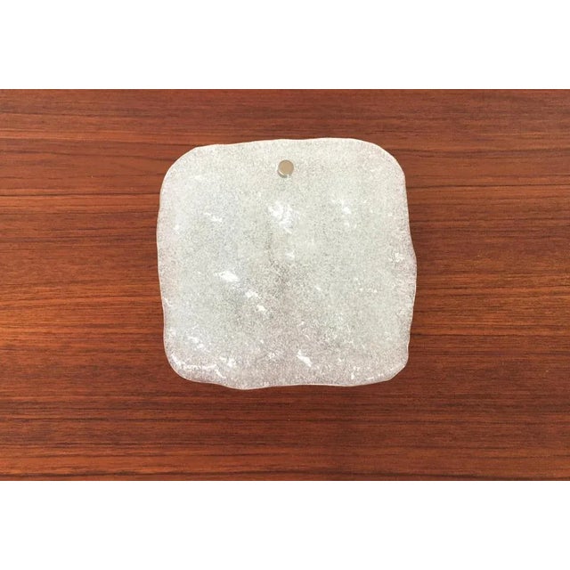 - Imposing wall light with ice glass element - The lights frame is elaborate and very functional - The thick ice glass...