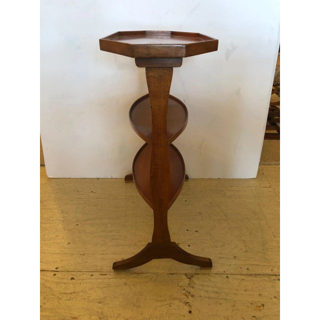 Superb Vintage Italian fruitwood side table having 3 tiers including an elongated octagonal top, two oval shelves below...