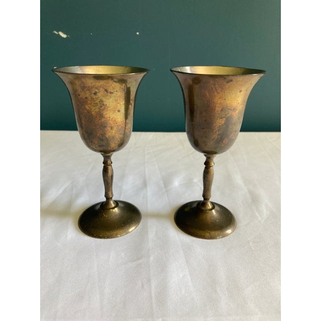 This matched pair of Sarna brass goblets represents fine Indian metalwork and exemplifies the beauty found in authentic...