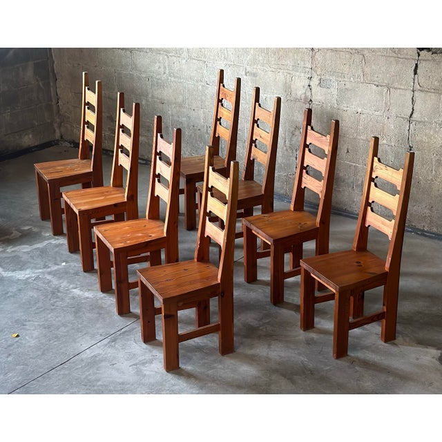 Striking sculptural ‘sports cabin’ dining chairs from Sweden. Made of acid stained pine with tall ladder backs dating from...