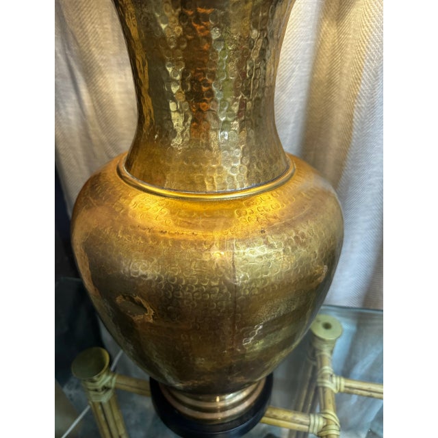 Spectacular oversized hand-hammered brass vase style table lamp. Original condition. Minimal bumps.