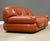 A post modern brown leather Sapporo loveseat sofa designed by Mario Marenco for Mobilgirgi. Attempt to restore color to...