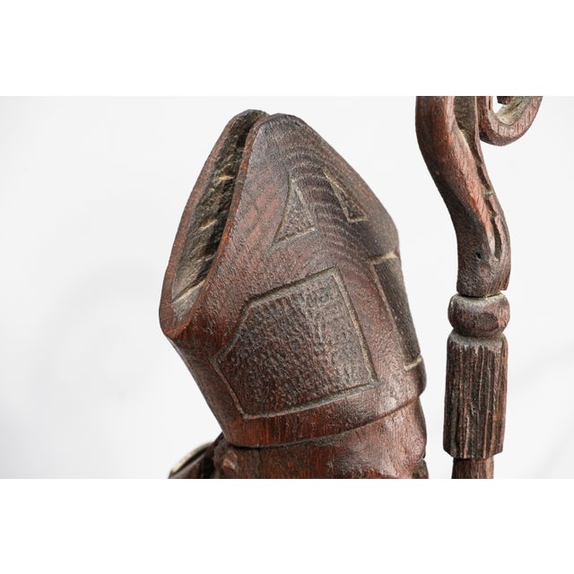 An evocative and richly sculptural example of 19th-century religious folk art, this antique hand-carved wooden figure...
