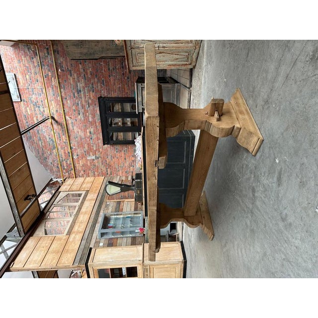 This solid oak monastery table dating from the 60's has been entirely restored. It features a magnificent 7.5 cm thick...