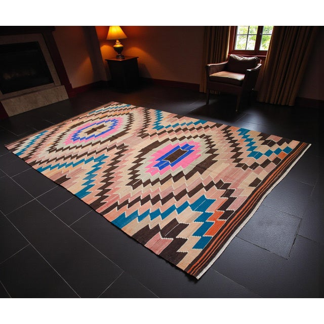 Woven in the 1970s in the Antalya region of Mediterranean Anatolia, this striking vintage flatweave kilim perfectly...