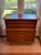 Warm wood grain and beautifully sculpted drawer fronts give this authentic Kent-Coffey “Foreteller” dresser unmistakable...