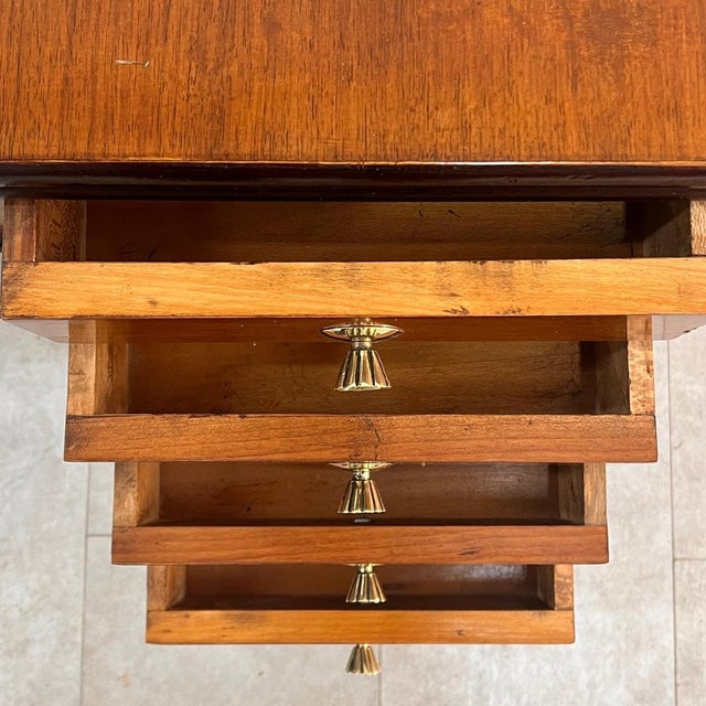 An elegant Italian writing desk from the 1940s, designed by Osvaldo Borsani. This piece embodies the excellence of...