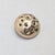 Circa 1969 textured goldtone round domed with prong set round faux-emeralds set into "craters" brooch with security clasp....