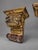 A pair of European carved wooden wall brackets with gilded and painted decoration, nineteenth century. Each takes the form...