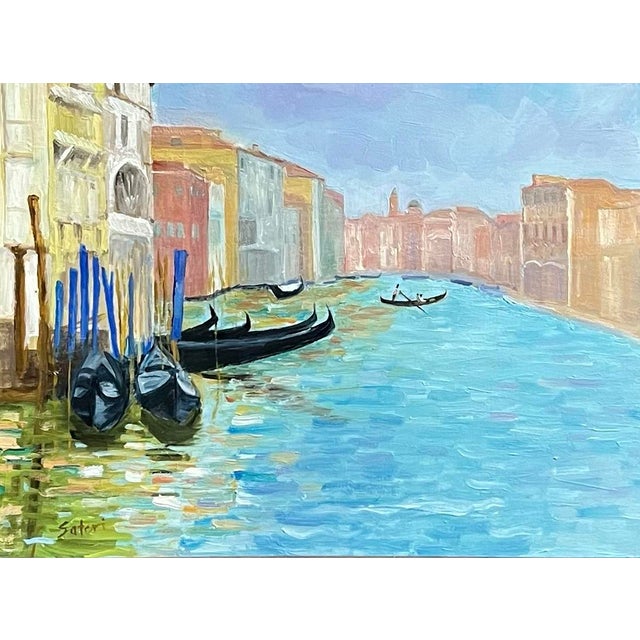 Oil painting on board of a Venice canal scene with buildings on either side, a gondola with passengers in the center and...