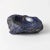 Small stone bowl with roughly finished edge. Made of sodalite, blue stone very similar to lapis lazuli.