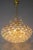 Crystal Glass and Gilt Brass Seven-Light Chandelier, made in Germany, in the late 1970s, is attributed to Christoph Palme....