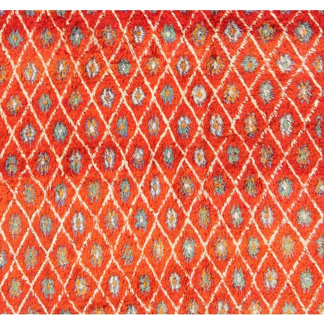 Measures: 6'9'' x 9'0''. This Moroccan rug has an all-over diamond geometric pattern with ivory outlines, set on a field...