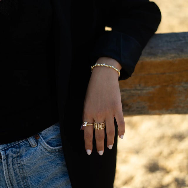 Shining with timeless elegance, the Radiant Majesty Diamond Gold Adjustable Cuff Ring blends modern sophistication with...