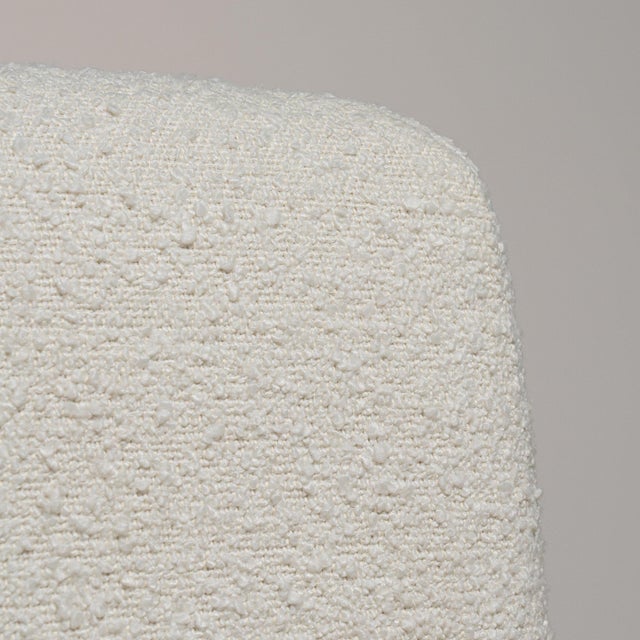 A armchair whose cream upholstery, natural wood frame gives it real character at first glance. It was made in France...