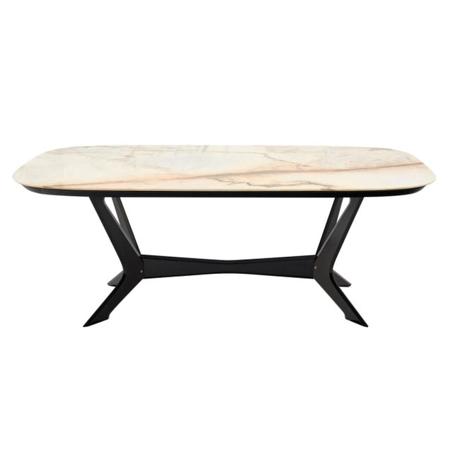 Dining table from Italy by designer Carlo di Carli. This piece has a solid mahogany base that has been ebonized and...