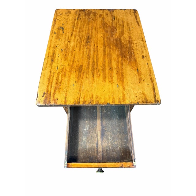 This is a very nice one drawer antique stand made out of pine.