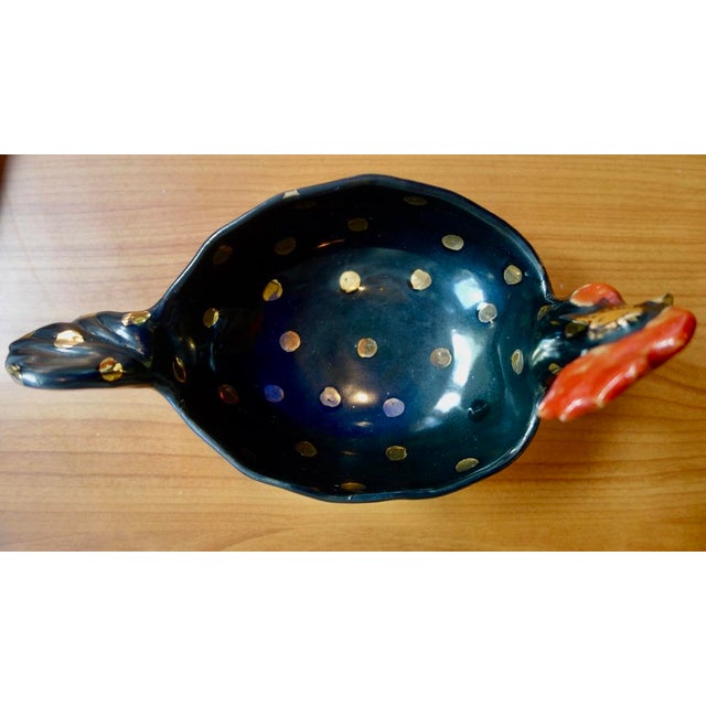 A rare and stunning Rooster dish with brilliant red cock and wattle and large gilt dots all over it. Gilt eyes, eyelashes,...