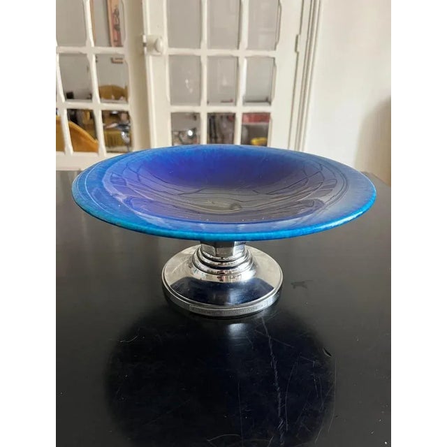 Rare modernist bowl of the 1930s signed Paul Millet, edited by the Manufacture de Sévres. Jassed blue earthenware cut,...