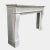 A large and impressive Louis XVI style fireplace mantel in Italian Carrara marble. The scrolled console legs, with...