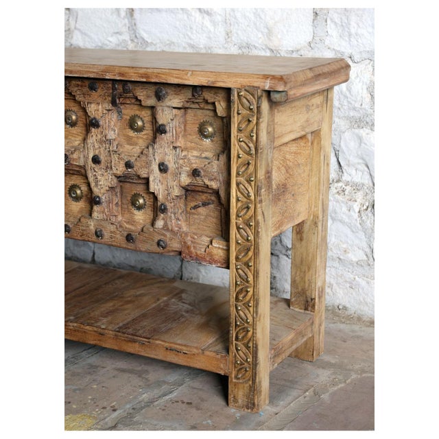 Crafted from an authentic reclaimed antique door, this hand-carved console table brings soulful character and timeless...