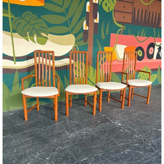 Classic Danish modern dining chair set, reupholstered in a cream animal print. Simple and sophisticated, these chairs are...