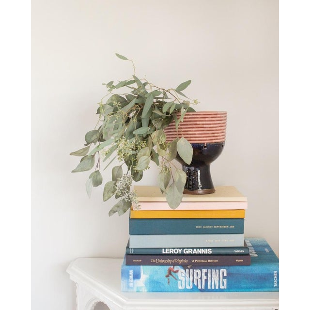 This versatile woven pedestal vase offers two unique looks in one piece. One side features intricate woven details, while...