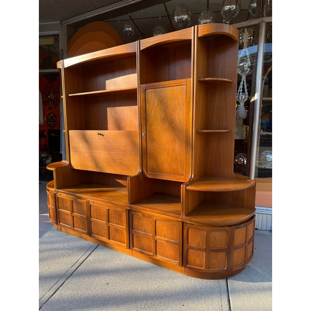 4 separate units, stand alone, or modular to fit your needs. Teak throughout all pieces. Outer cabinets are corner pieces....