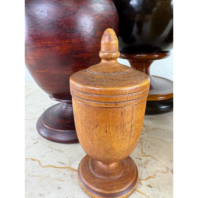 This is a complementary grouping of hand turned wooden vessels. This is a handmade collection of turned wooden vases and...