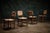 Charlotte Perriand set of four straight back chairs from the 1960s featuring woven seats and backs with a distinctive...