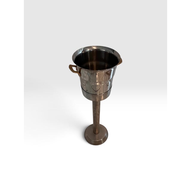 Elegant vintage Spring Switzerland champagne or wine cooler with matching pedestal stand, circa 1960s–1970s. Crafted in...