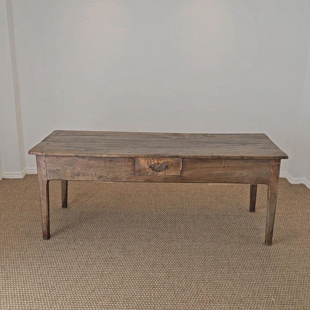 Dimensions:28"D x 76.75"W x 29.75"H Skirt to floor: 19.25"H A beautifully timeworn French farmhouse dining table, rich...