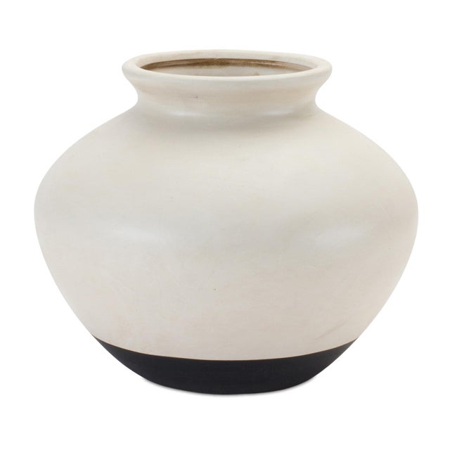 Bring refined elegance into your living space with this Two-Tone Ceramic Urn Vase. Designed in a timeless silhouette, this...