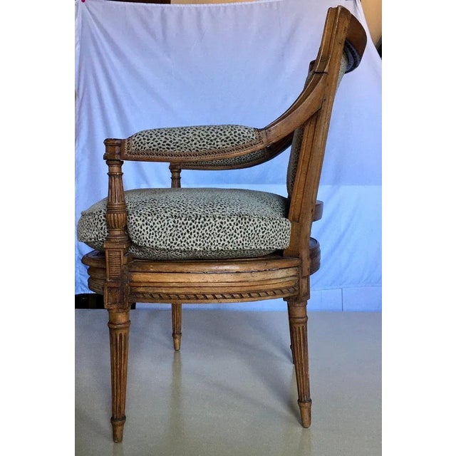 French Louis XV style cane seat accent armchair with upholstered arm and back and loose feather down stuffed seat cushion....