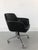The office chair in black leather and structure with chrome-plated iron castors. The height is be adjusted 44-54