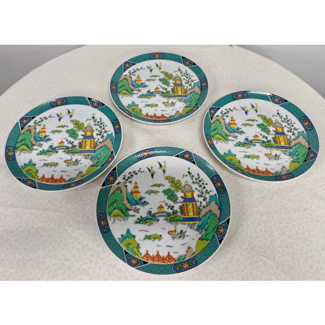 Vintage eight piece set of Chinese Garden plates and cups. This popular pattern features the classic chinoiserie motif...