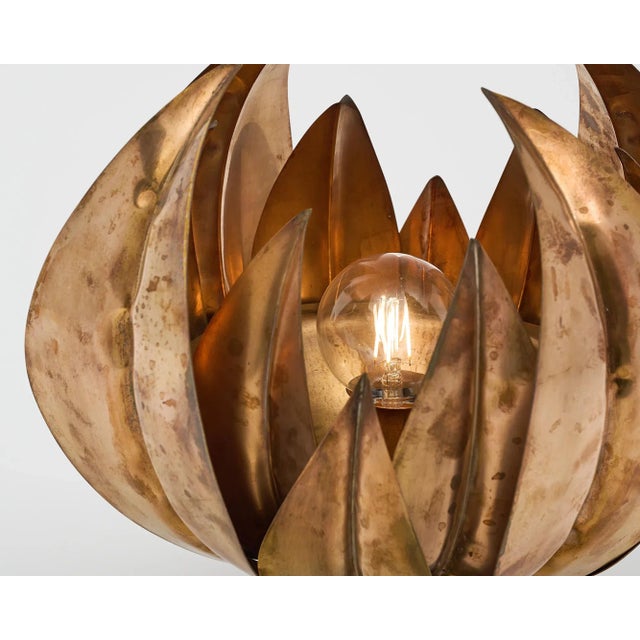 Lamp, French, in the modernist style by Maison Charles. The lamp features an array of hand embossed brass leaves flaring...
